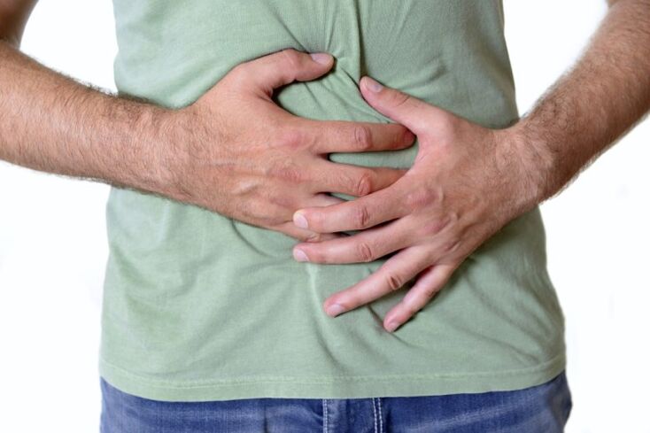 Pain and bloating - symptoms of the presence of worms in the intestine